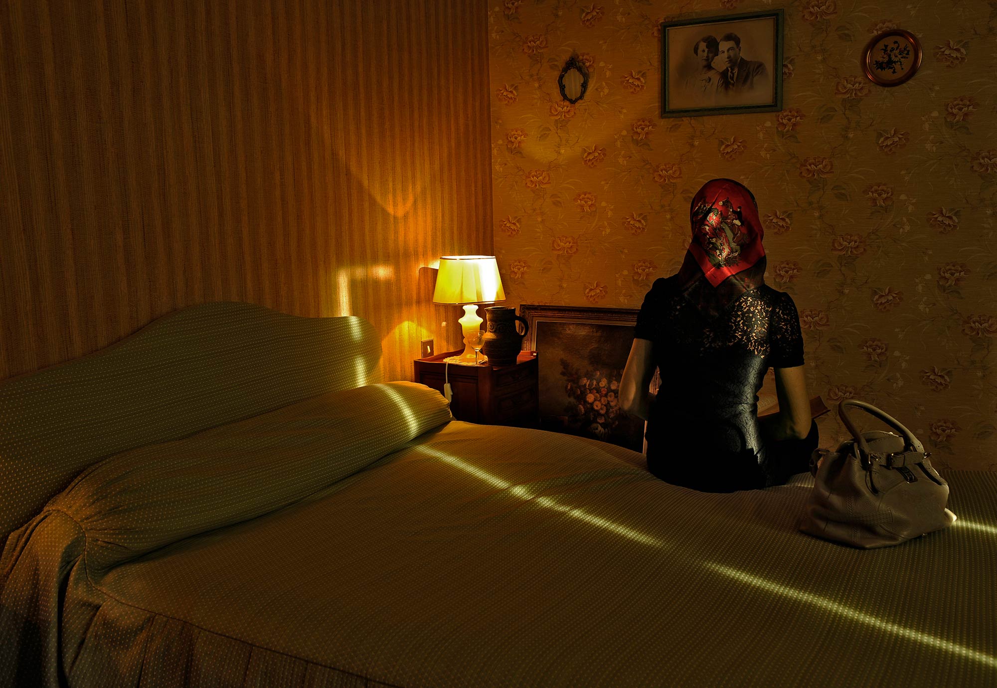 #55) "La Lectrice" This touches me on so many levels. My wife sitting on my mother's bed with my grandparent's watching from the photo on the wall.